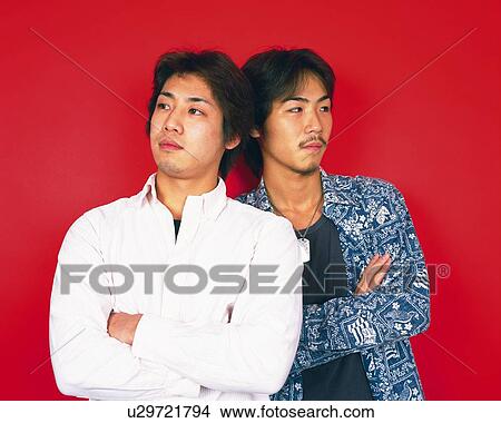 Picture - Portrait of Young Men Folding Arms, Front View. Fotosearch