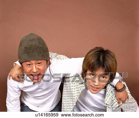 Portrait of Young Men with Arms Around Shoulders, High Angle View View Large Photo Image Stock Photo - Portrait of Young Men with Arms Around Shoulders, High Angle View. Fotosearch