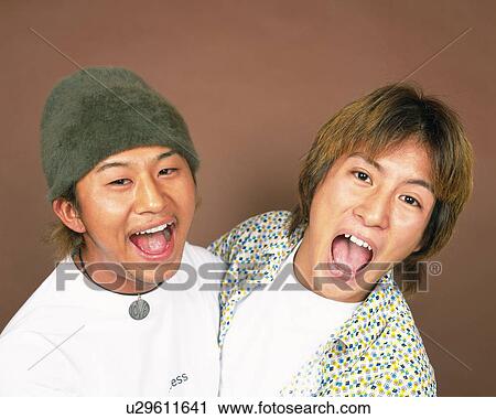 Stock Image - Portrait of Young Men With Mouths Open, Front View . Fotosearch