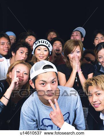 Stock Photo - Portrait of Young People Posing, Front View. Fotosearch