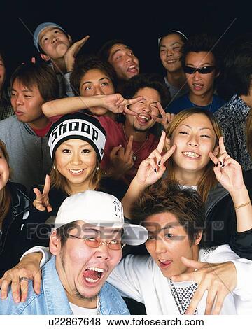 Stock Photo - Portrait of Young People Posing, Front View, Full Frame. Fotosearch