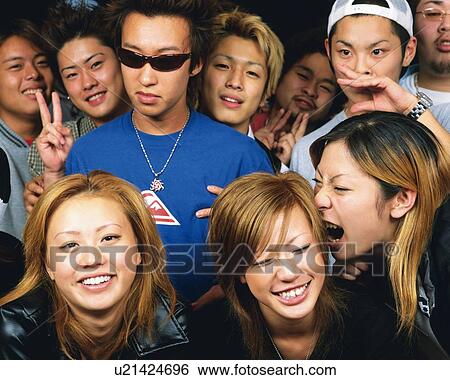 Stock Photograph - Portrait of Young People Posing, Front View, Full Frame. Fotosearch