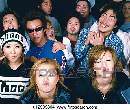 Picture - Portrait of Young People Posing, Making a Face, High Angle View, Full Frame. Fotosearch