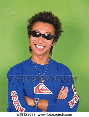 Young Man Folding Arms, Wearing Sunglasses, Portrait, Front View View Large Photo Image Stock Image - Young Man Folding Arms, Wearing Sunglasses, Portrait, Front View. Fotosearch