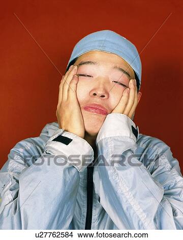 Picture - Young Man Making a Face, Smiling, Portrait, Front View. Fotosearch