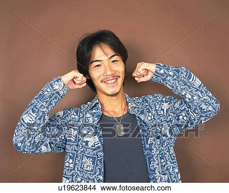 Picture - Young Man Smiling, Raised Arms, Portrait, Front View. Fotosearch