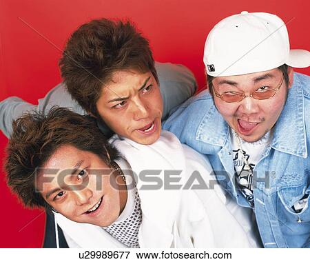 Stock Photo - Young Men Making a Face, Portrait, Front View. Fotosearch