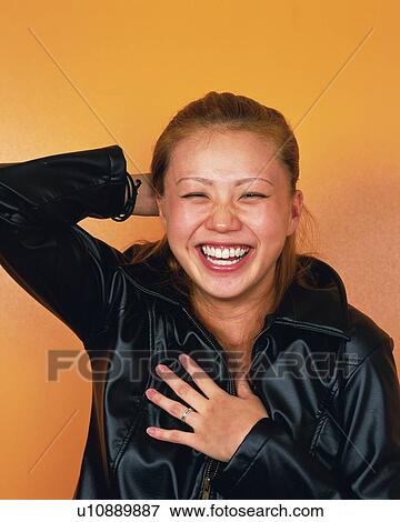 Stock Photo - Young Woman Smiling, Portrait, Front View . Fotosearch