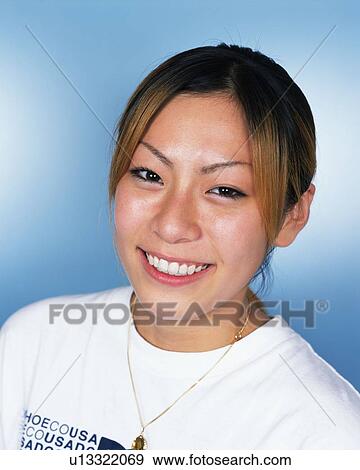 Stock Photo - Young Woman Smiling, Portrait, Front View . Fotosearch