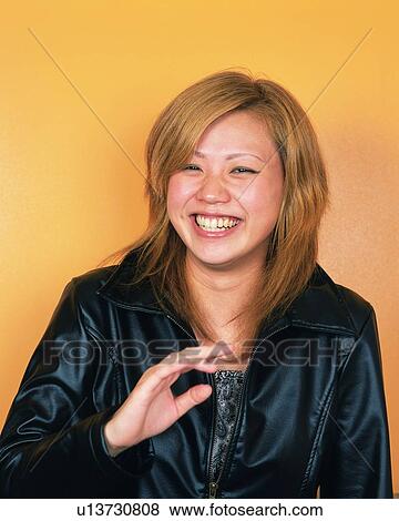 Stock Photo - Young Woman Smiling, Portrait, Front View . Fotosearch