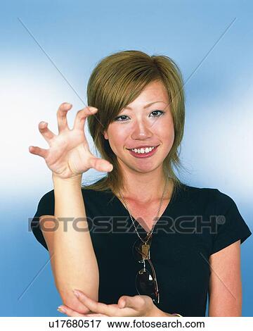 Stock Photo - Young Woman Smiling, Portrait, Front View . Fotosearch