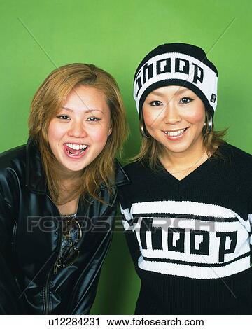 Young Women Smiling, Portrait, One Woman Wearing Knit Cap, Front View View Large Photo Image Stock Image - Young Women Smiling, Portrait, One Woman Wearing Knit Cap, Front View . Fotosearch