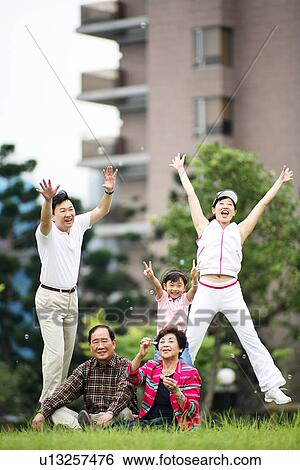 A family in cheerful mood. View Large Photo Image Stock Photograph - A family in cheerful mood.. Fotosearch