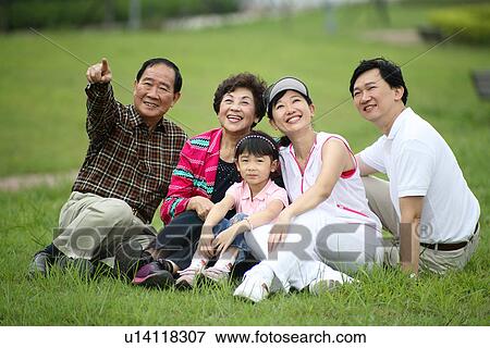 Stock Photo - Family sitting together.. Fotosearch