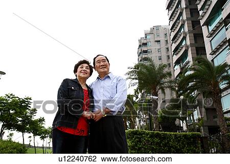 Stock Image - Low angle view of a senior couple.. Fotosearch