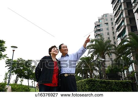 Stock Photo - Low angle view of a senior couple.. Fotosearch
