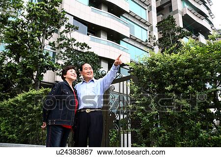 Stock Photo - Low angle view of a senior couple.. Fotosearch