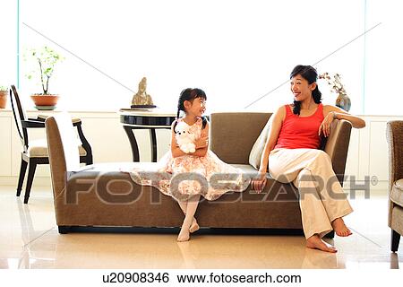 Stock Photograph - View of a daughter enjoying with her mother.. Fotosearch