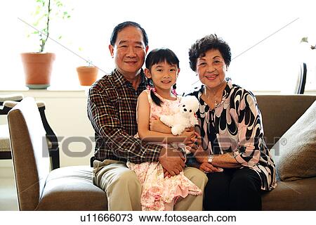View of a family looking at camera. View Large Photo Image Stock Image - View of a family looking at camera.. Fotosearch