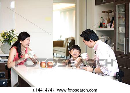 Stock Photo - View of a family on dining table.. Fotosearch