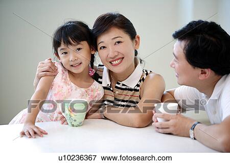 View of a family smiling. View Large Photo Image Stock Photo - View of a family smiling.. Fotosearch