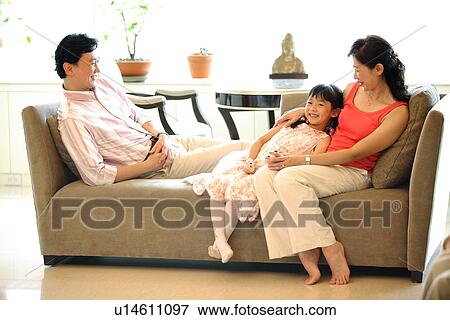 View of a girl enjoying with her parent. View Large Photo Image Stock Photo - View of a girl enjoying with her parent.. Fotosearch