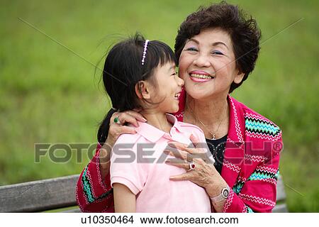 View of a girl enjoying with her grandmother. View Large Photo Image Picture - View of a girl enjoying with her grandmother.. Fotosearch