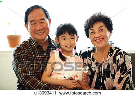 Stock Image - View of a girl with her grandparent.. Fotosearch