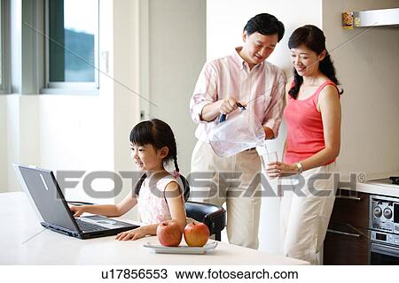 Stock Image - View of a man pouring water in the glass.. Fotosearch