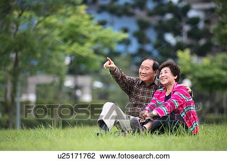 View of aged couple relaxing. View Large Photo Image Stock Image - View of aged couple relaxing.. Fotosearch