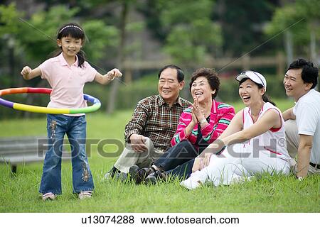 View of family members enjoying. View Large Photo Image Stock Photo - View of family members enjoying.. Fotosearch