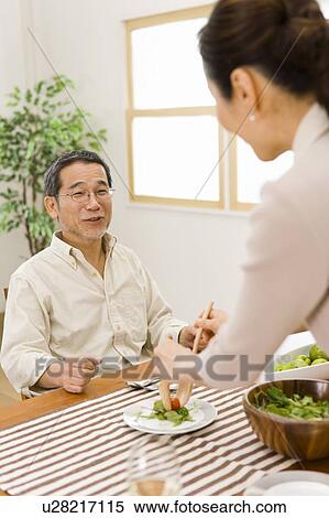A Mature Adult Couple Having a Meal, Front View, Side View, Rear View, Differential Focus View Large Photo Image Stock Photography - A Mature Adult Couple Having a Meal, Front View, Side View, Rear View, Differential Focus. Fotosearch