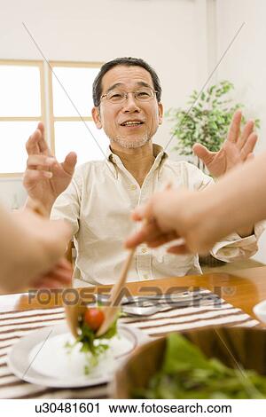Hands Serving Salad For A Mature Adult Man, Front View, Differential Focus View Large Photo Image Stock Image - Hands Serving Salad For A Mature Adult Man, Front View, Differential Focus. Fotosearch