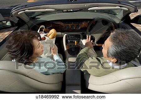 A Senior Adult Couple on a Convertible Car, High Angle View, Rear View View Large Photo Image Stock Image - A Senior Adult Couple on a Convertible Car, High Angle View, Rear View. Fotosearch