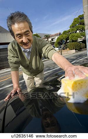 A Senior Adult Man Washing His Car, Front View View Large Photo Image Stock Photograph - A Senior Adult Man Washing His Car, Front View. Fotosearch