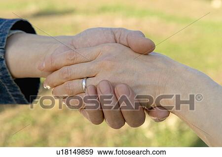 Closed Up Image of Holding Hands Wearing a Ring, Differential Focus View Large Photo Image Stock Photo - Closed Up Image of Holding Hands Wearing a Ring, Differential Focus. Fotosearch