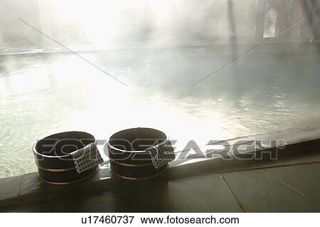 Stock Photo - Hot Spring Tub with Two Wooden Pails in the Foreground. Fotosearch