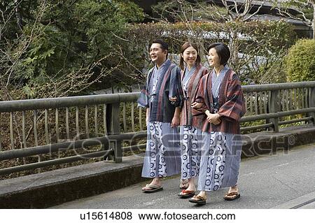 Mature Adult Couple and their Daughter Walking Arm in Arm, Side View, Full Length View Large Photo Image Stock Photo - Mature Adult Couple and their Daughter Walking Arm in Arm, Side View, Full Length. Fotosearch