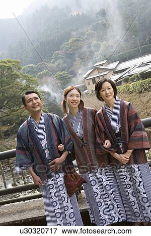 Mature Adult Couple and their Daughter Looking at Something, Front View, Three Quarter Length View Large Photo Image Stock Photo - Mature Adult Couple and their Daughter Looking at Something, Front View, Three Quarter Length. Fotosearch