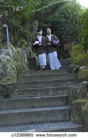 Mature Adult Couple in Yukata Going Down Stairs, Front View, Full Length, Low Angle View View Large Photo Image Stock Photography - Mature Adult Couple in Yukata Going Down Stairs, Front View, Full Length, Low Angle View. Fotosearch