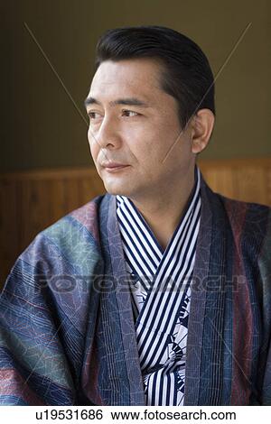 Stock Photograph - Mature Adult Man Wearing Yukata and Looking Away, Front View, Head and Shoulder. Fotosearch