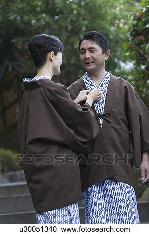 Mature Adult Woman Checking the Husband's Yukata, Front View, Rear View, Three Quarter Length View Large Photo Image Stock Image - Mature Adult Woman Checking the Husband's Yukata, Front View, Rear View, Three Quarter Length. Fotosearch