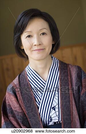 Stock Photo - Portrait of a Mature Adult Woman in Yukata, Looking at Camera, Front View, Head and Shoulder. Fotosearch