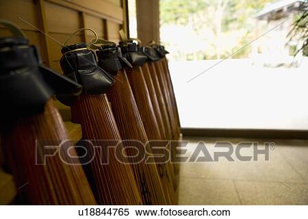 Stock Photography - Lined-up Coarse Oilpaper Umbrellas, Close Up. Fotosearch