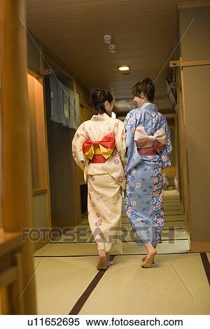 Two women in Yukata walking on tatami mats, rear view, Japan View Large Photo Image Stock Photography - Two women in Yukata walking on tatami mats, rear view, Japan. Fotosearch