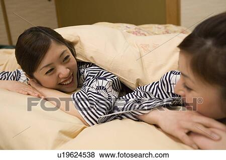 Two women talking in beds, side view, Japan View Large Photo Image Stock Photo - Two women talking in beds, side view, Japan. Fotosearch