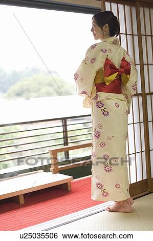 Woman in Yukata looking outside from the window, rear view, Japan View Large Photo Image Stock Photograph - Woman in Yukata looking outside from the window, rear view, Japan. Fotosearch