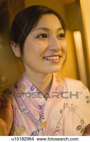Picture - Woman in Yukata smiling, front view, Japan. Fotosearch
