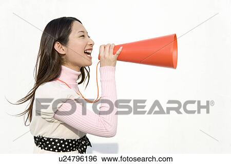 A woman holding a megaphone, side view, white background View Large Photo Image Stock Photograph - A woman holding a megaphone, side view, white background. Fotosearch