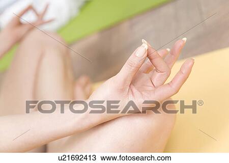 A Young Woman Practicing Yoga, Body Part, High Angle View, Differential Focus, Close Up View Large Photo Image Stock Image - A Young Woman Practicing Yoga, Body Part, High Angle View, Differential Focus, Close Up. Fotosearch